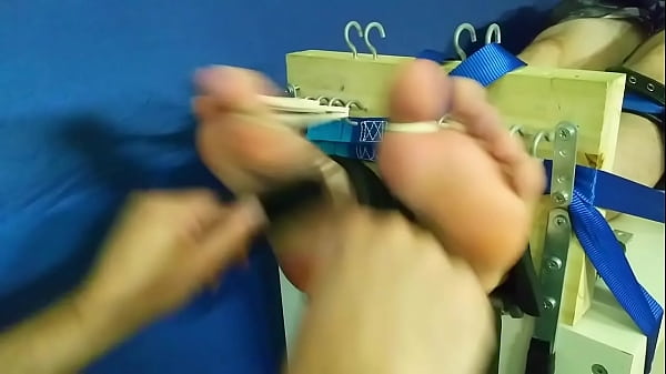 He tickles my feet in a straightjacket!