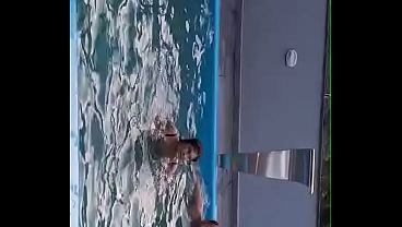 Redhead plays in the pool sucking a dick until she gets cumshot